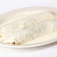 Philly Steak Burritos · Two burritos filled with steak, bell peppers, onions and mushrooms. Topped with our white qu...