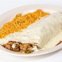 Burrito Tapatio · One big flour tortilla filled with carnitas, onions, mushrooms, jalapenos and beans. Topped ...