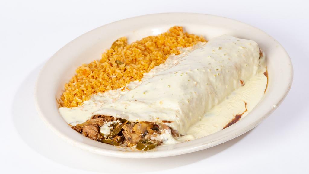 Burrito Tapatio · One big flour tortilla filled with carnitas, onions, mushrooms, jalapenos and beans. Topped with our red sauce and special white queso dip. Served with rice.