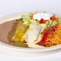 Enchiladas Tricolor · Three enchiladas stuffed with steak or grilled chicken. One topped with green sauce, one top...