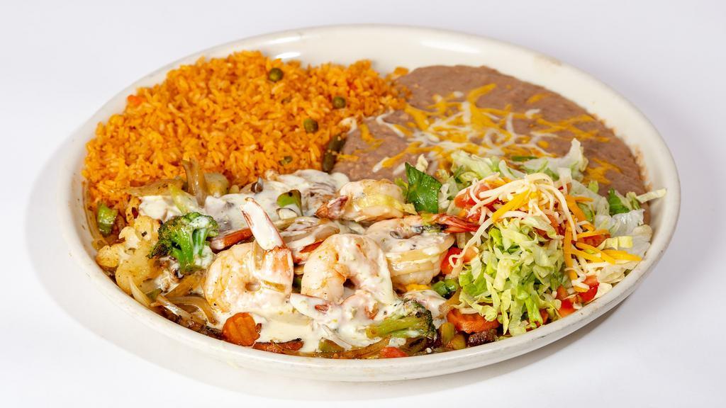Pollo Los Cabos · Grilled chicken breast topped with grilled shrimp, mushrooms, onions and our special white queso dip. Garnished with lettuce, tomatoes and cheese. Served with rice and beans.