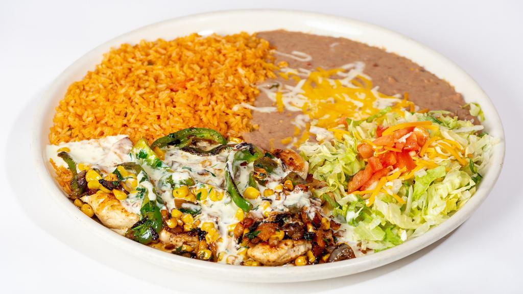 Pollo Campestre · Grilled chicken breast topped with grilled vegetables tomatoes, onions, bell peppers, çilántro and corn. Smothered in our white queso dip. Garnished with lettuce, tomatoes and cheese, served with rice and beans.
