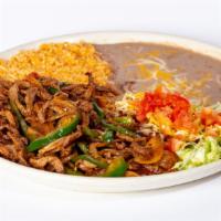 Steak Ranchero · Sirloin steak sliced and fried with bell peppers, onions, tomatoes and jalapenos. Garnished ...