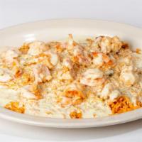 Shrimp & Rice · Sautéed shrimp over a bed of rice and topped with white queso dip.