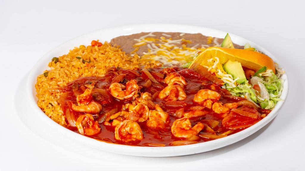 Camarones A La Diabla · Shrimp, onions and mushrooms sautéed in butter and our tasty red sauce. Served with tortillas, rice beans and a side of lettuce topped with tomatoes, cheese sliced avocado and an orange slice.