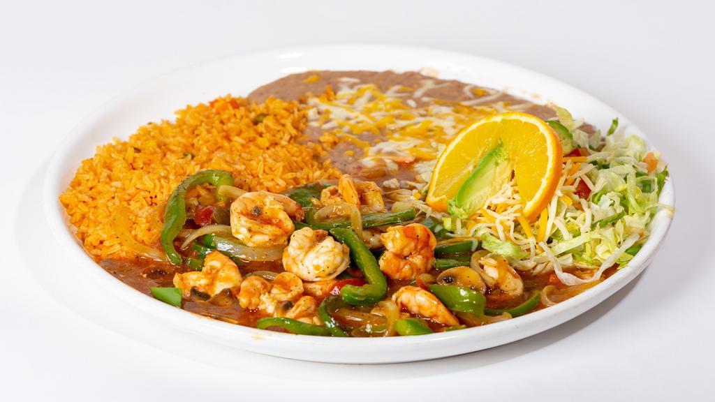 Camarones Rancheros · Shrimp sautéed in a ranchera sauce with onions, mushrooms, tomatoes and bell peppers, served with rice and beans.