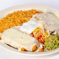 Two Chimichangas · Topped with white queso dip,  lettuce  , tomato, sour cream and guacamole . With rice (No Be...