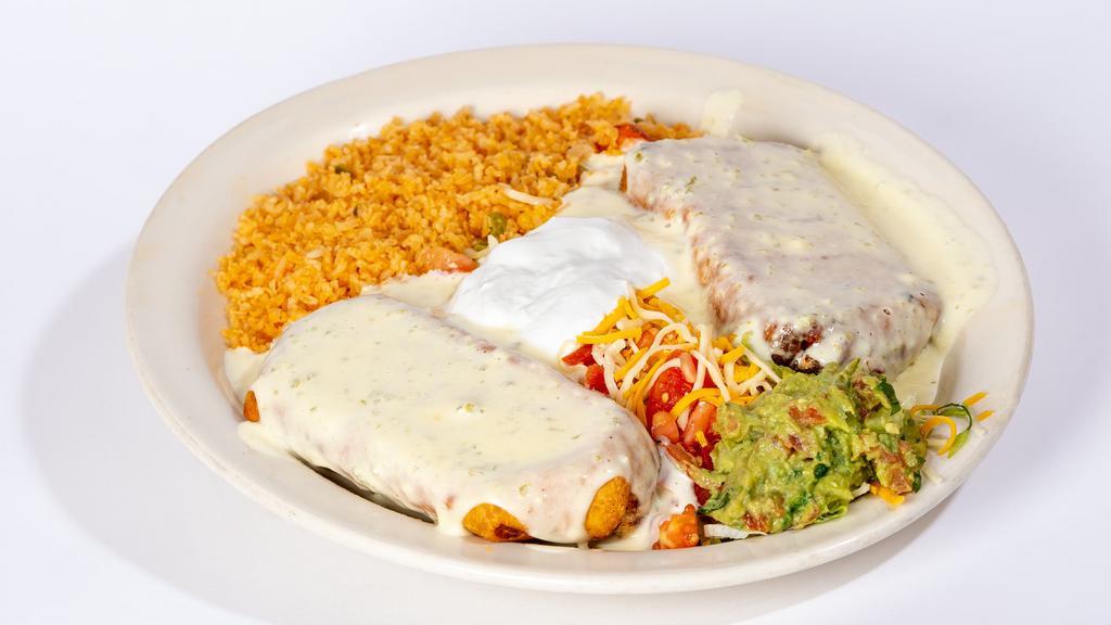 Two Chimichangas · Topped with white queso dip,  lettuce  , tomato, sour cream and guacamole . With rice (No Beans) (your choice of filling)