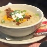 Loaded Potato Soup · Topped with shredded cheddar, bacon, scallions, and sour cream