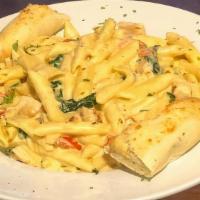 Chicken Florentine Alfredo · Grilled chicken, penne pasta, light alfredo sauce, spinach, tomatoes, served with a breadstick