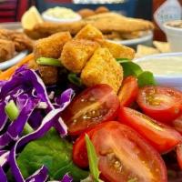 House Salad · Spring Mix, grape tomatoes, shredded cheddar jack cheese, croutons, red onions and carrots