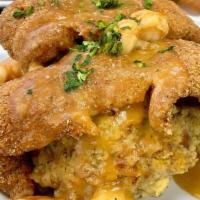 Creole Heaven · Fried Catfish over a bed of seafood cornbread dressing, smothered in Ettoufee . (can sub dre...