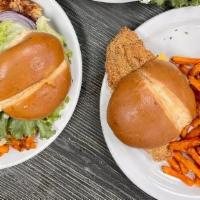 Deluxe Fish Sandwich · Fried Catfish filet on a soft bun with cheese, creamy house made tarter sauce, lettuce and t...