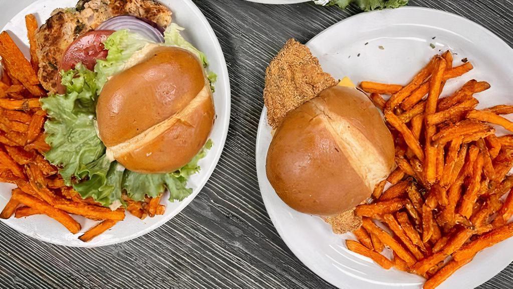 Deluxe Fish Sandwich · Fried Catfish filet on a soft bun with cheese, creamy house made tarter sauce, lettuce and tomatoes. . Served with French fries