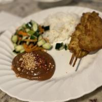 Chicken Satay · Gluten free. Chicken breast marinated in yellow curry paste served with peanut sauce.