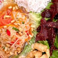 Som Tum Taad (Laos Style) · Gluten free. Papaya salad pressed with shrimp paste, served with choice of Lao's jerky or sa...
