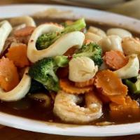Lad Nah · Shrimp, scallop, and squid stir-fried with broccoli and tapioca gravy sauce over wide rice n...