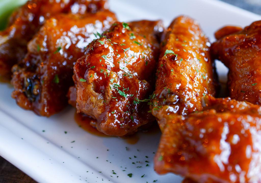 Chicken Wings · Crispy and on the bone offered simply fried or tossed in your choice of sauce. Served with celery sticks and ranch or blue cheese. Buffalo, Garlic Parmesan, General Tso's