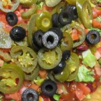Loaded Nachos · Tri-colored ranch tortilla chips layered with melted cheddar, chili with beans, black olives...
