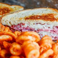 Classic Corned Beef Reuben · Lean corned beef with Swiss cheese, sauerkraut and Thousand Island dressing on freshly grill...