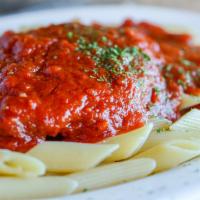 Chicken Parmesan · Plump juicy breaded chicken cutlets with our homemade sauce, over your choice of pasta. Serv...
