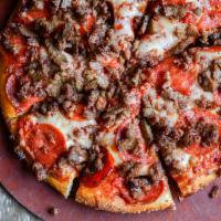 Meat Trio · Our special sauce topped with meatballs, pepperoni, sausage, and blended cheeses. For meat l...