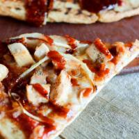 Bbq Chicken Pizza · pizza dough topped with fresh tomato sauce, mozzarella, onions, chicken and BBQ sauce.