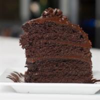 Chocolate Fudge Cake Slice · Four layers of chocolate, piled high with rich chocolate fudge. A chocoholic's dream.