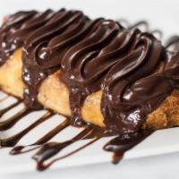 Eclair · Large eclair shell bursting with Bavarian cream and topped with our homemade fudge frosting.