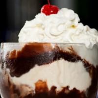 Chocolate Sundae · Two scoops of ice cream topped with hot fudge, whipped cream and a cherry on top.