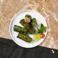 Dial Dolmas · (Six pieces) Grape leaves are stuffed with meat, herbs and rice mixture.