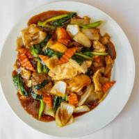 Cambodian Style Stir Fried Cantonese Noodle · Prepared with flat wide rice noodle, Chinese broccoli, peapod, carrot and onion.