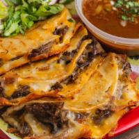 Signature Birria Tacos (3) · Three fresh corn tortillas, stuffed with our tangy house-marinated stewed beef. We dip each ...