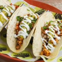 Steak Taco Trio · OUR TAKE ON CARNE ASADA. SEASONED AND FLAME-GRILLED TO PERFECTION! - Three Tacos, on corn to...