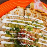 Steak Quesadilla · A 10” flour tortilla filled with melted mexican cheese and your choice of filling. Topped wi...