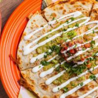 Cheese Quesadilla · A 10” flour tortilla filled with melted mexican cheese and your choice of filling. Topped wi...