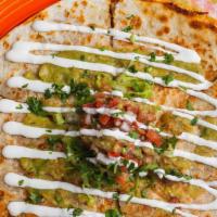 Carnitas Quesadilla · A 10” flour tortilla filled with melted mexican cheese and your choice of filling. Topped wi...