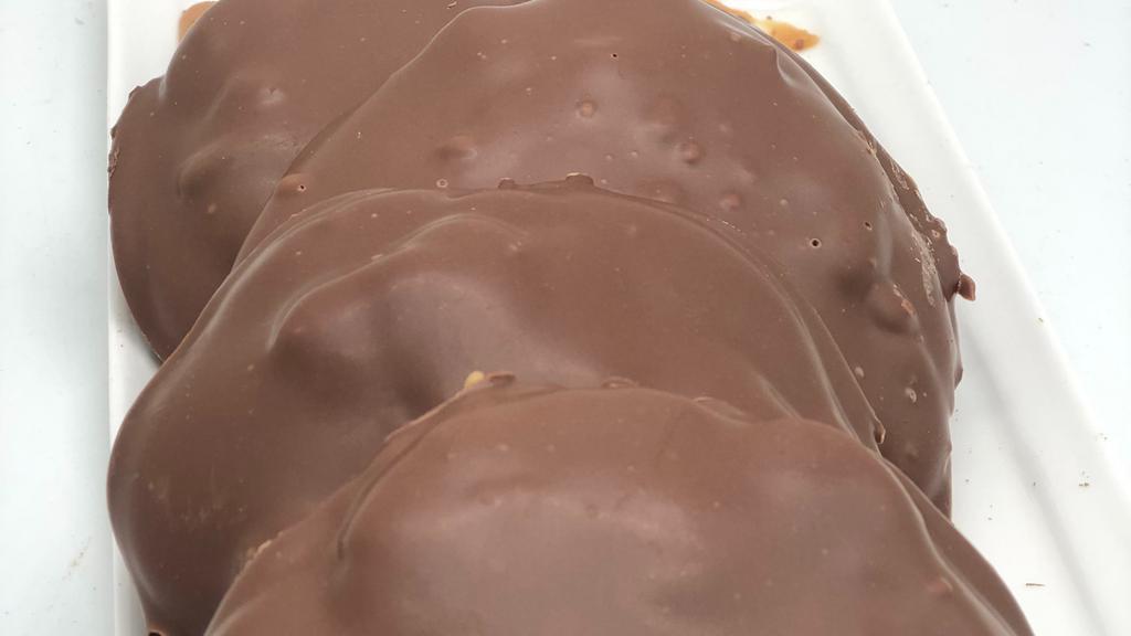 Milk Chocolate Pecan Turtle · Roasted pecans mixed in with homemade caramel and covered in gourmet chocolate.