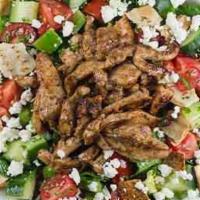 Chicken Feta Fattoush Salad · our traditional fattoush salad topped with chicken shawarma & feta cheese with fattoush dres...