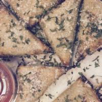 Spinach & Feta Triangles · Baked filo dough triangle stuffed with sauteed spinach and feta cheese, served with marinara...