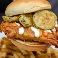 Pic Fil-A Chicken Sandwich · Fried chicken breast topped with fried pickle slices, cool ranch and secret sauce. Served on...