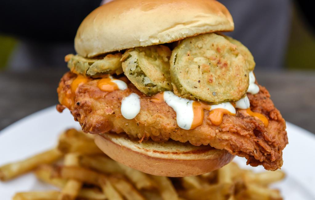 Pic Fil-A Chicken Sandwich · Fried chicken breast topped with fried pickle slices, cool ranch and secret sauce. Served on a grilled brioche bun.