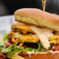 West Coast Double  · American Cheese, Grilled white onions, burger sauce, Lettuce, tomato, and pickles.  On a Bri...