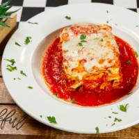 The Empire Lasagna · Stacked high, 100% ground beef, lotsa cheese, tomato-bechamel sauce, baked to perfection