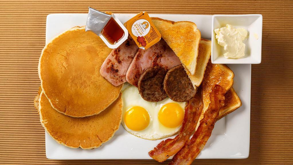 Pancake Platter · 2 Fluffy White Pancakes with 2 Eggs your way, and your choice of 2 Pork Sausage Patties, 2 Pork Bacon Strips, 2 Turkey Sausage Patties, 2 Turkey Bacon Strips or 1 Piece of Ham. Includes 2 syrup.