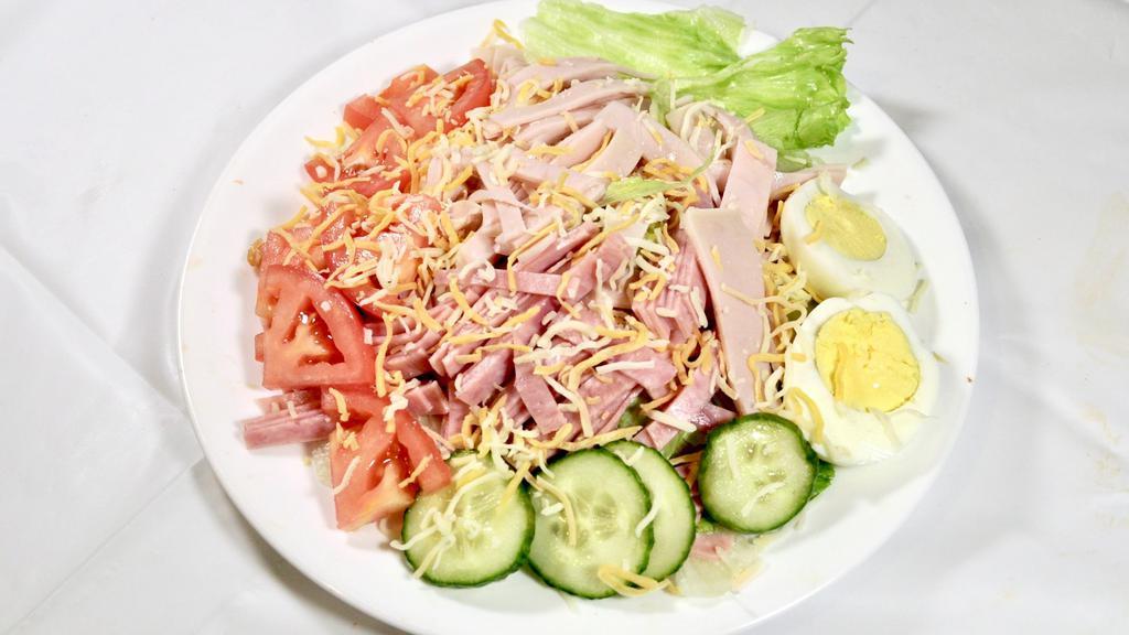 Chef Salad · Ham and turkey with lettuce, tomato, boiled egg and cheese. Includes 2 packs of salad dressing of your choice.