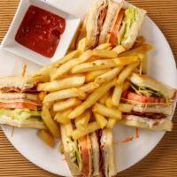 Club Sandwich Combo · Turkey, ham, two pieces of bacon, mayonnaise, lettuce, tomato and cheese. Combo comes with a...