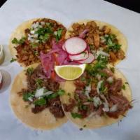 Tacos · 4 Street tacos. corn  tortilla, with your choice of meat, onion and cilantro.