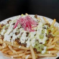 Taquiza Fries · French fries, your choice of  meat, sour cream and guacamole, cheese, and cotija cheese.