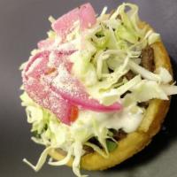 Sopes · 3 Deep fried corn sopes with Refried beans, your choose of meat, cabbage, onion, cilantro, c...